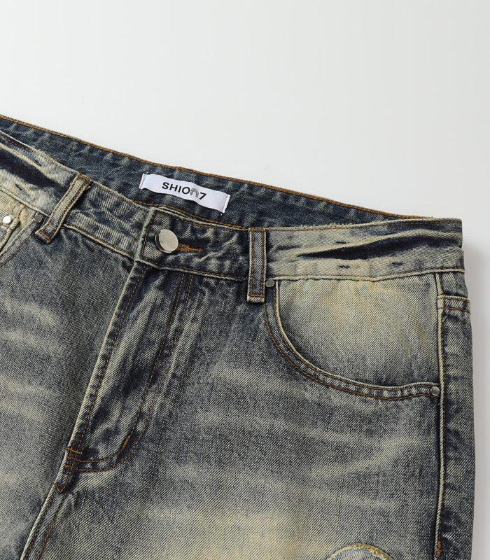 Dark blue patched denim jeans